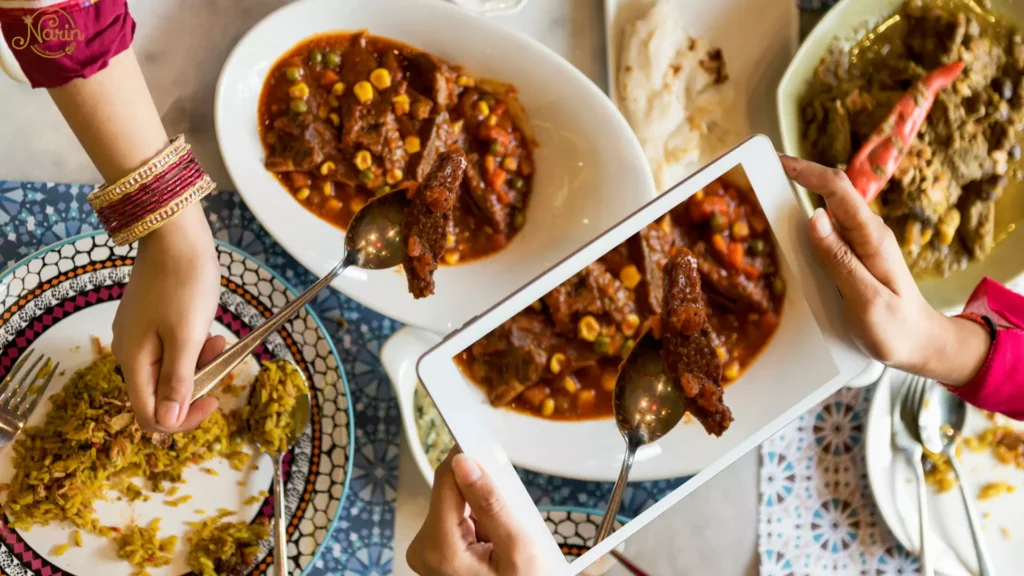 Diners taking a photo of a delicious meat stew and rice, highlighting exactly what to order at a Persian restaurant like Narin.